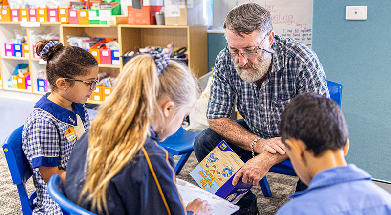 Teacher with class at St Matthew's Catholic Primary Windsor