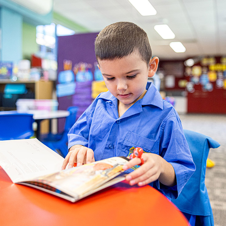 Boy reading at St Mathew's Catholic Primary Windsor